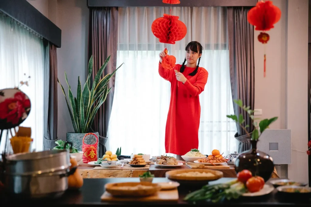 Girl doing a decoration for Chinese New Year 