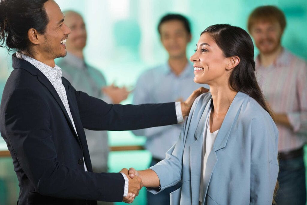 Man shake hand a women selected staff with ATS